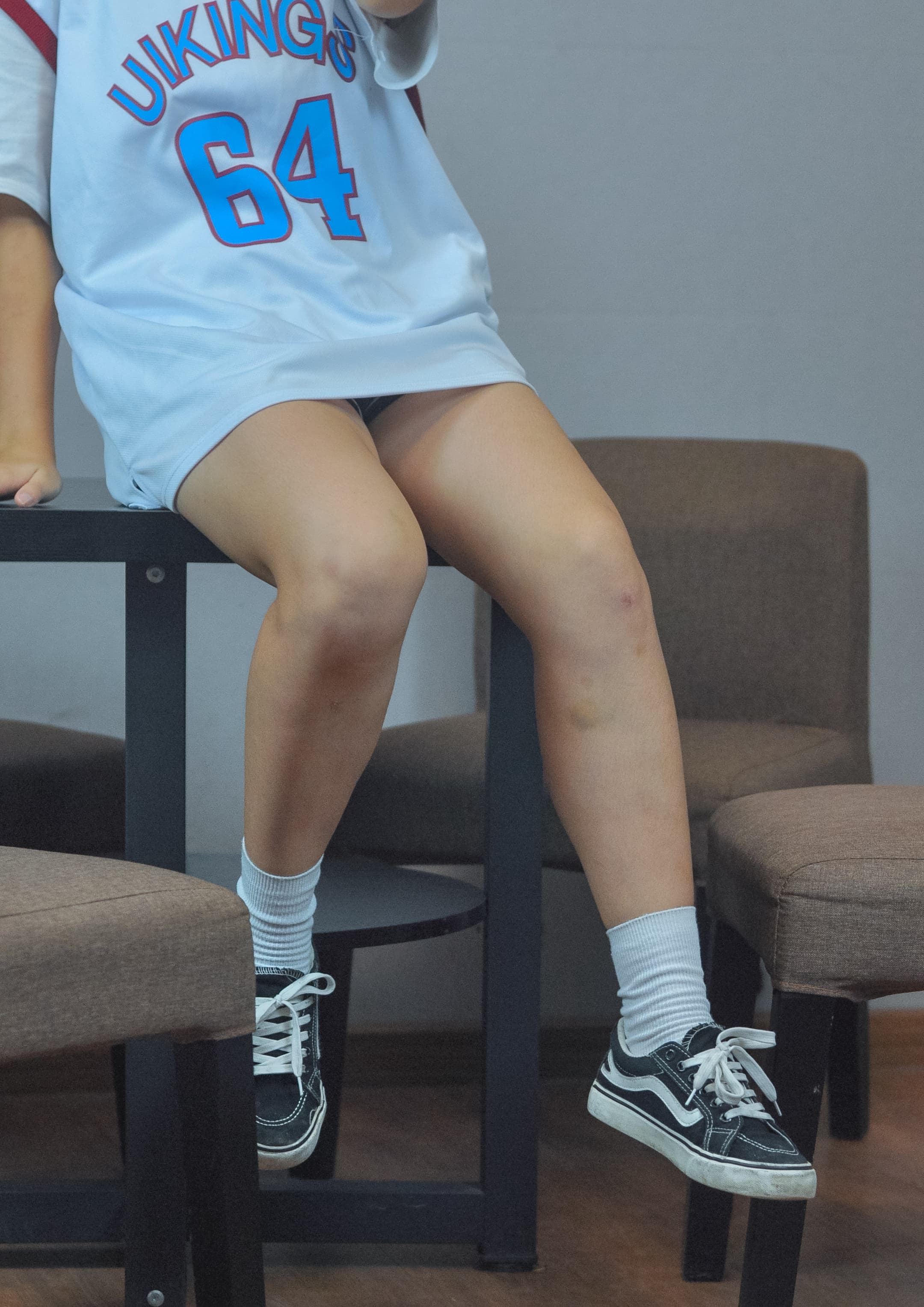 White cotton socks peeking from canvas shoes