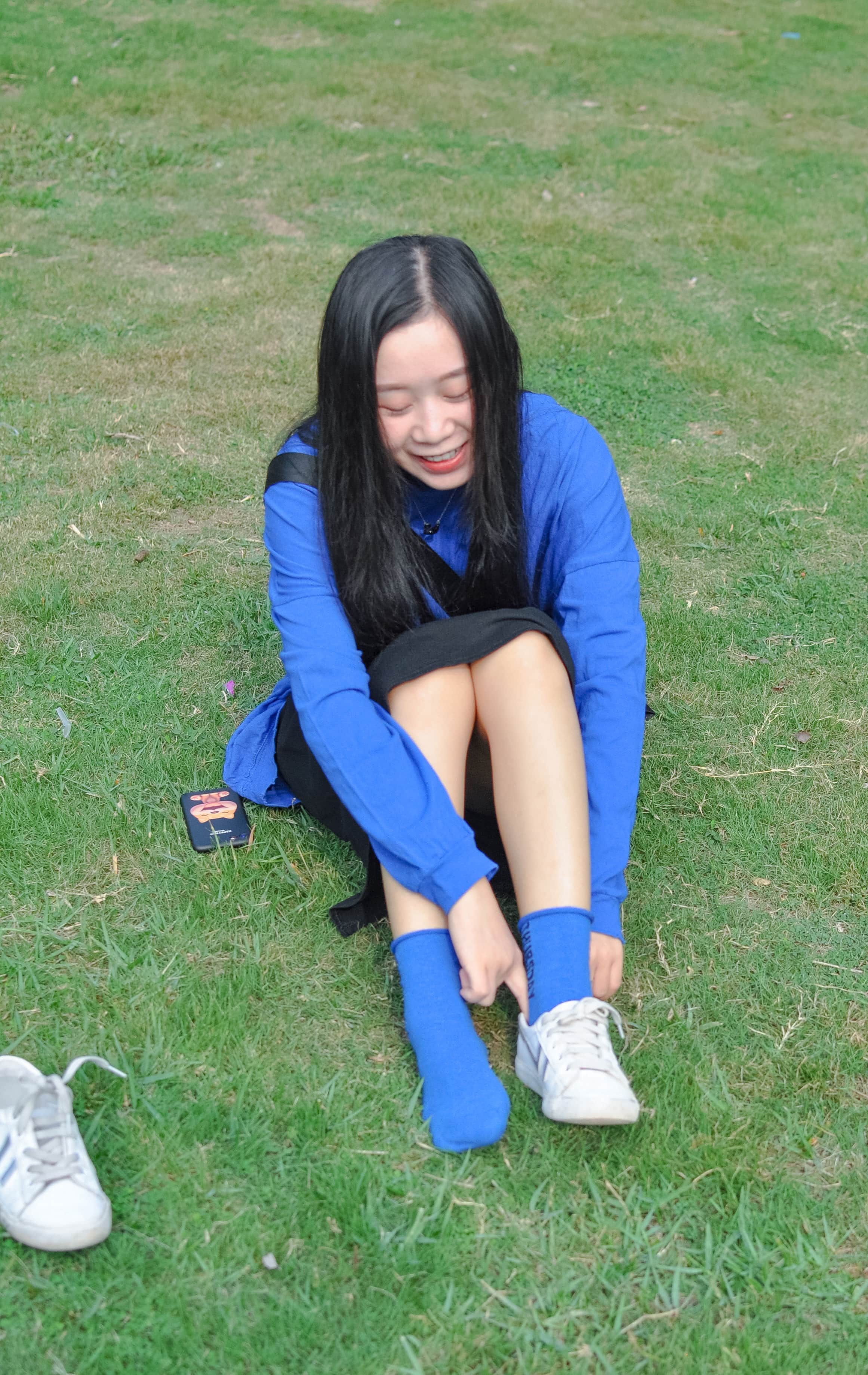 Bare foot on sunlit grass surface