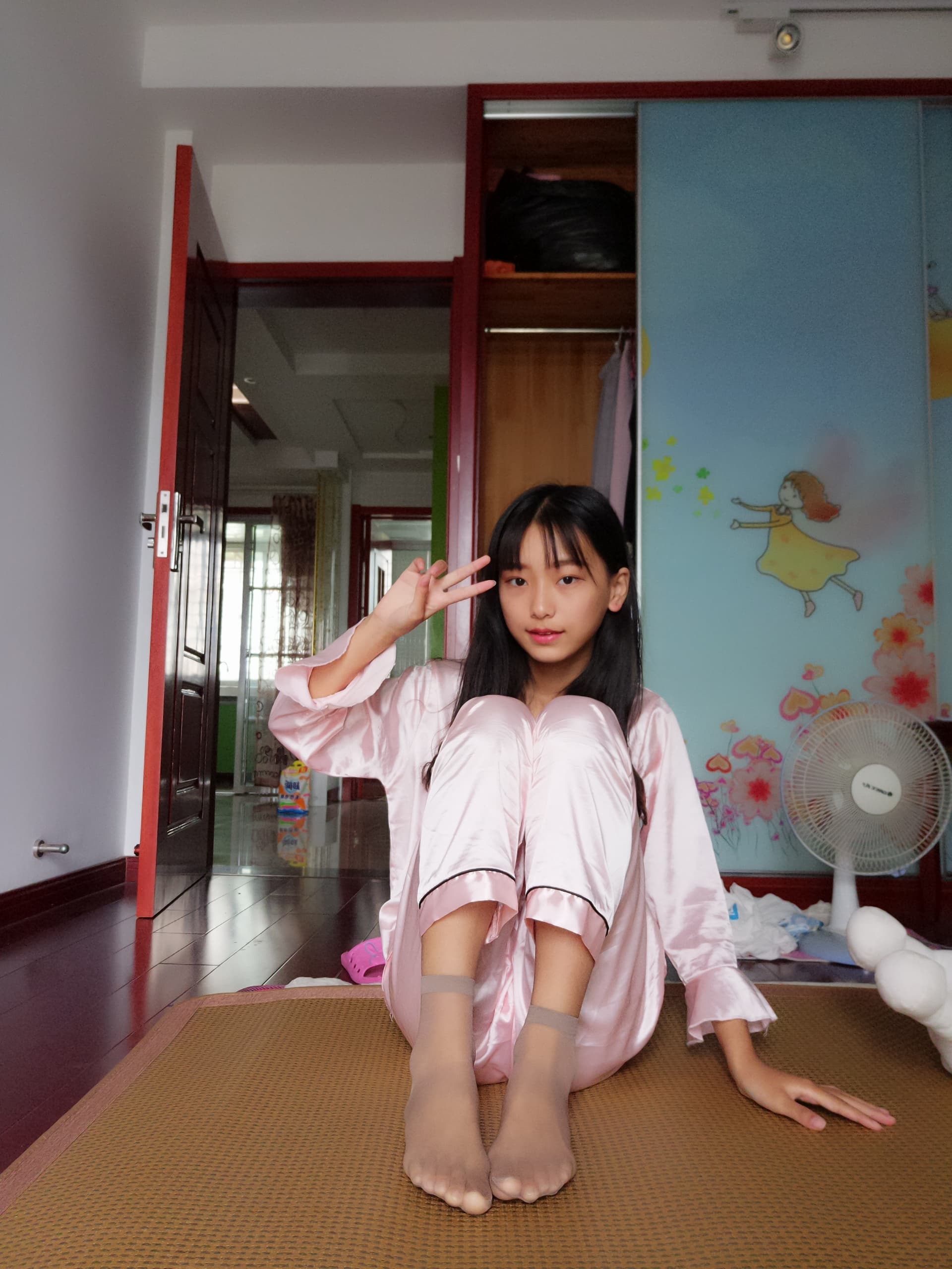Dark brown short stockings paired with a floral skirt, bare toes peeking and soft lighting