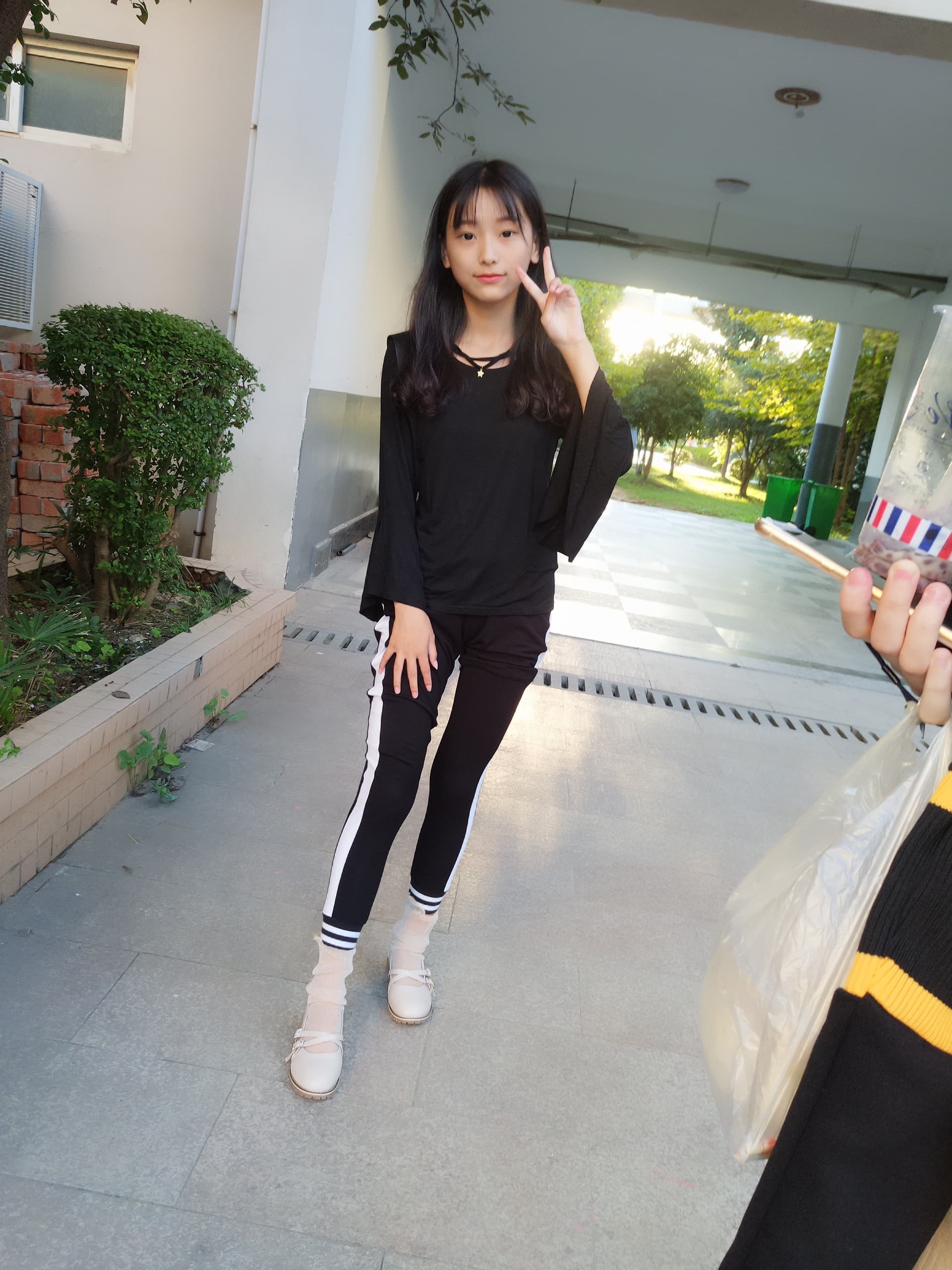 Adult model in a mini skirt with sheer stockings, toes peeking, campus-inspired interior lighting