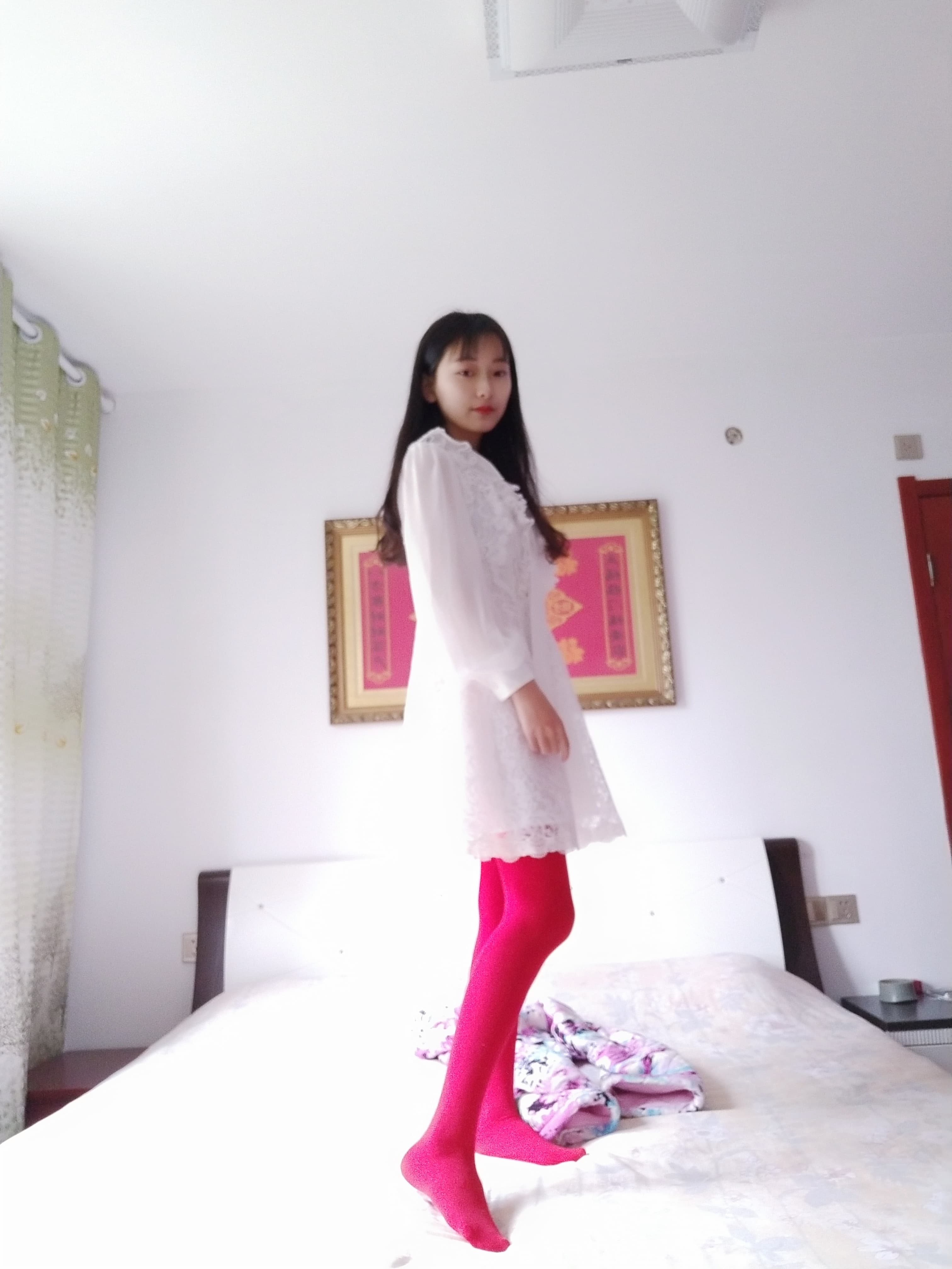 red tights on bed sheets
