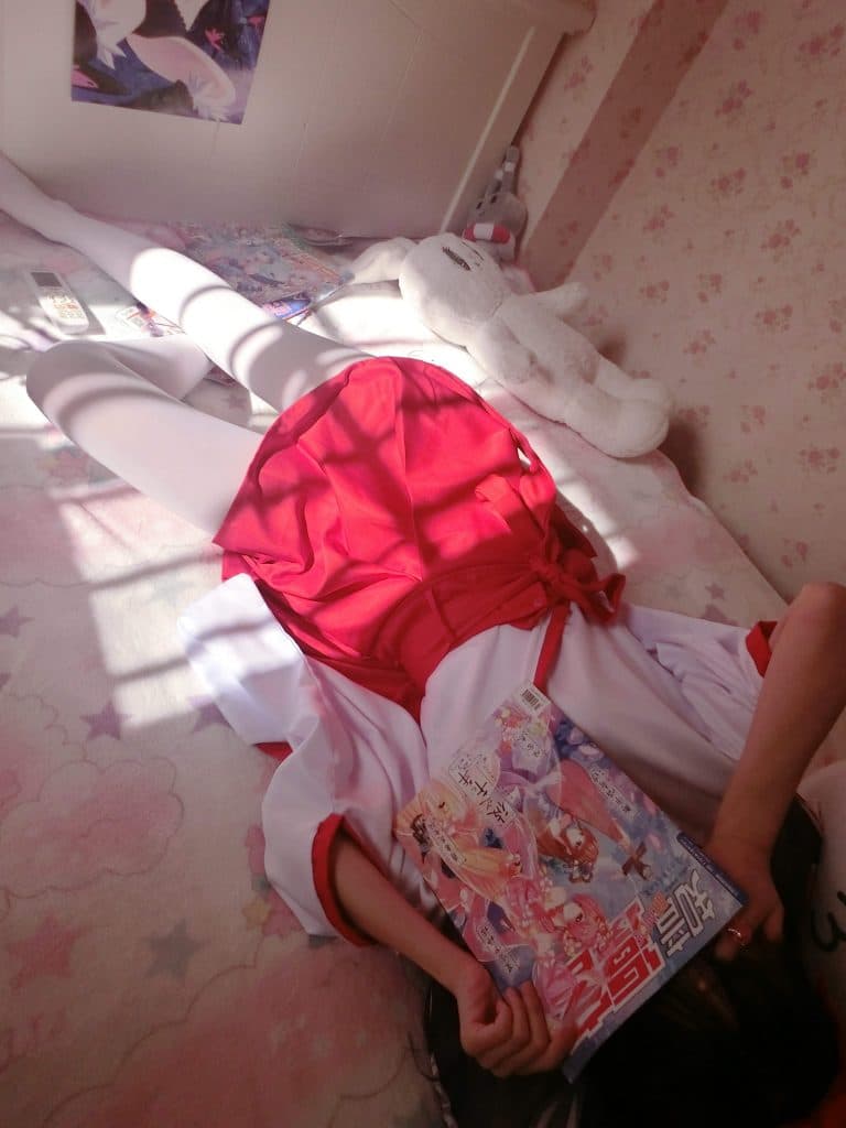 Close-up of ankle and toes emerging from traditional attire, nylon sheen catching soft ambient light