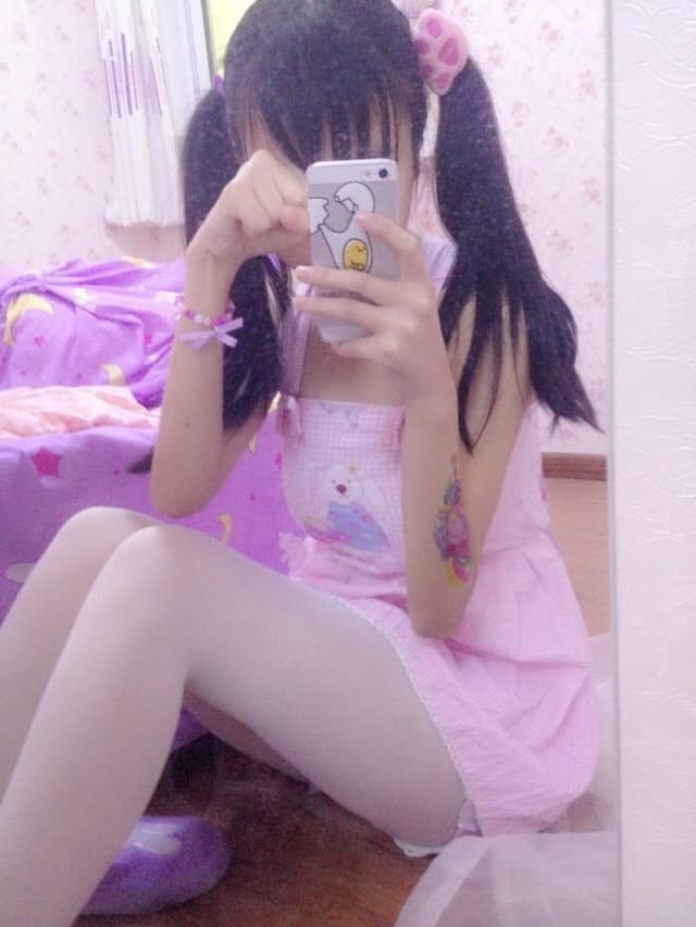 Nylon legs bathed in purple light