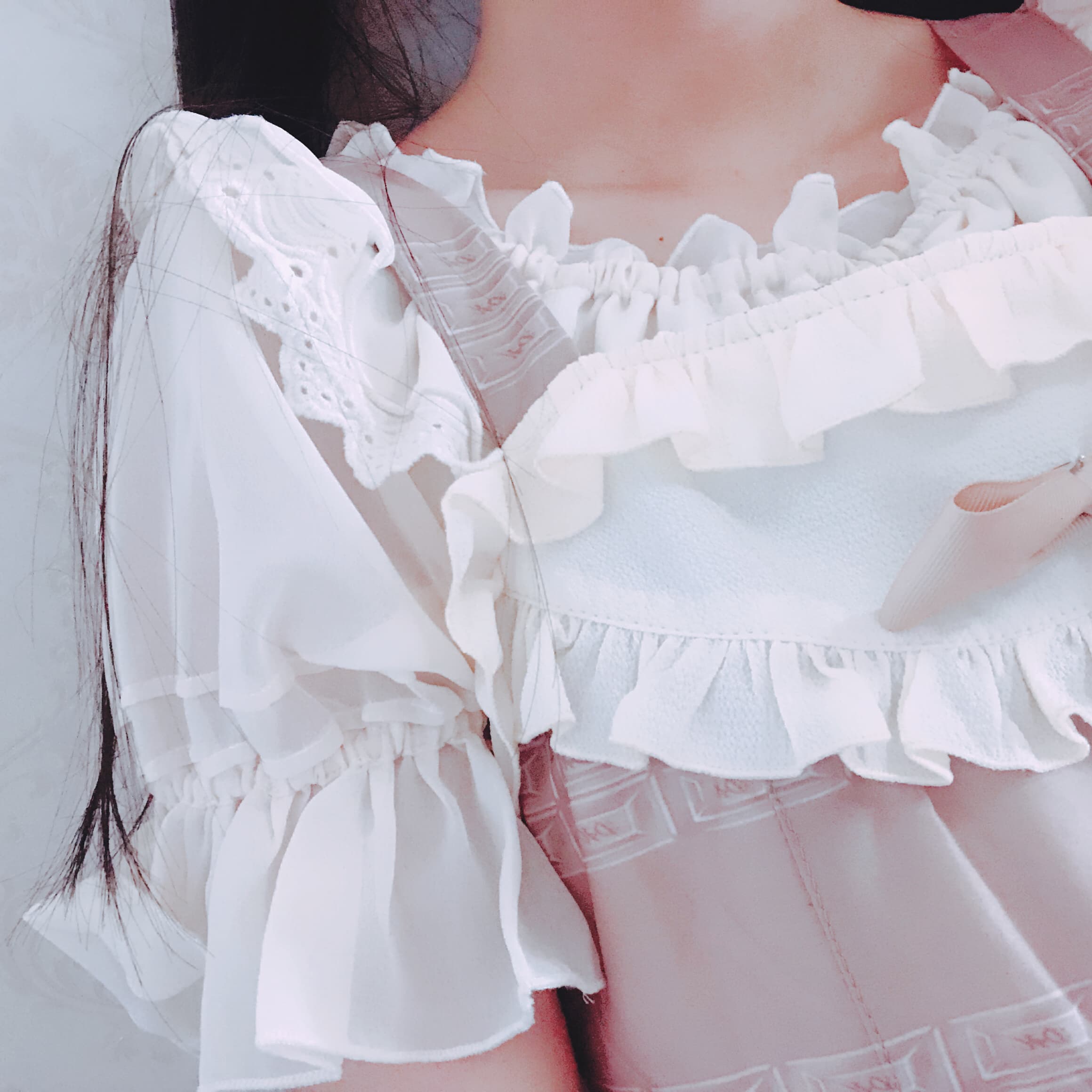 White stockings peeking from under a playful skirt, legs posed to emphasize sheer fabric and thigh-high edges