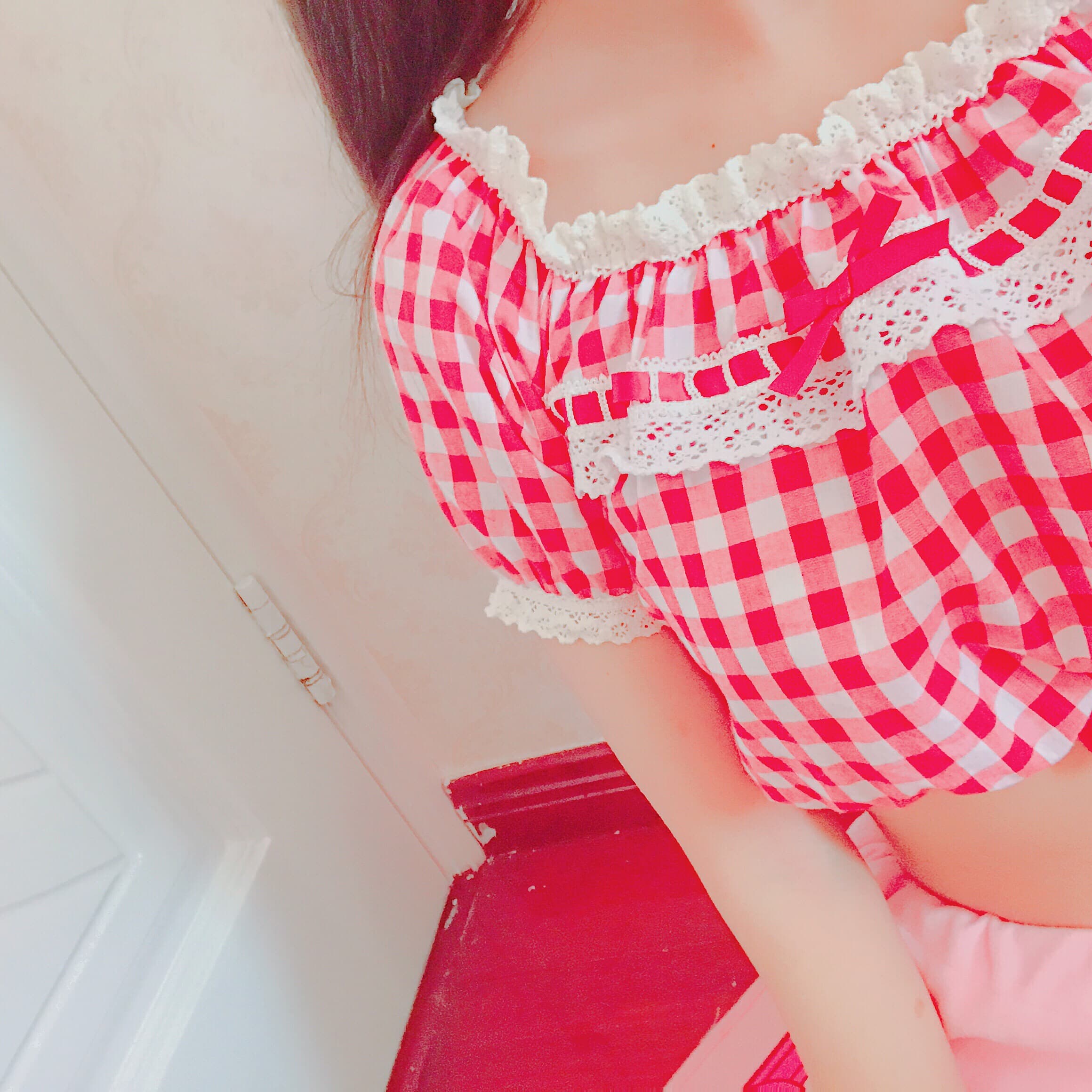 Close shot of pantyhose toes and smooth calves under short pink shorts, soft light accentuating the sheen