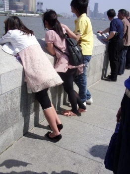 Street Style: Wind Lifts the Skirt of a Black Stockings Girl