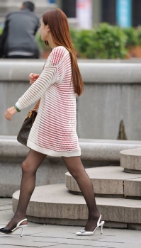Pure Girl with Black Stockings Smiling Sweetly on the Street