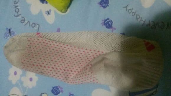 Girlfriend is sleeping, taking off her cotton socks to see her feet