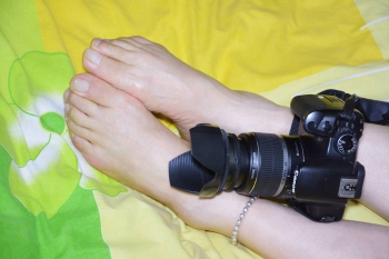 Bare feet and camera shooting