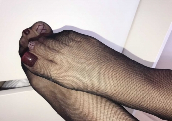 Manicure Looks Even Better with Black Stockings