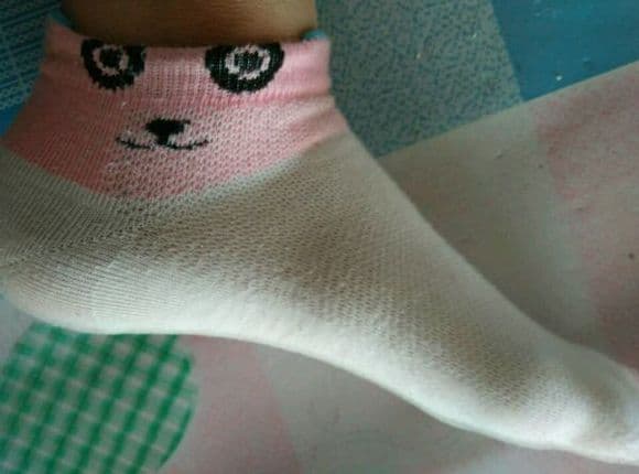 A girl's various colorful cotton socks with original scent