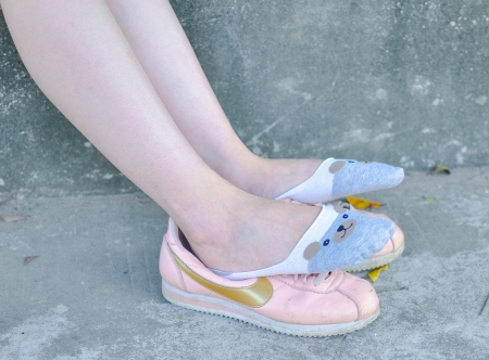 Teen girl in Plaid Skirt & Pink sneakers