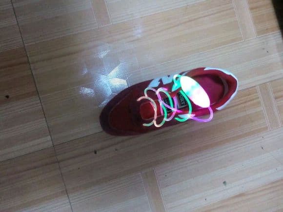 Close-up of an adult partner's feet snug in worn cotton socks, toes slightly visible and fabric creased