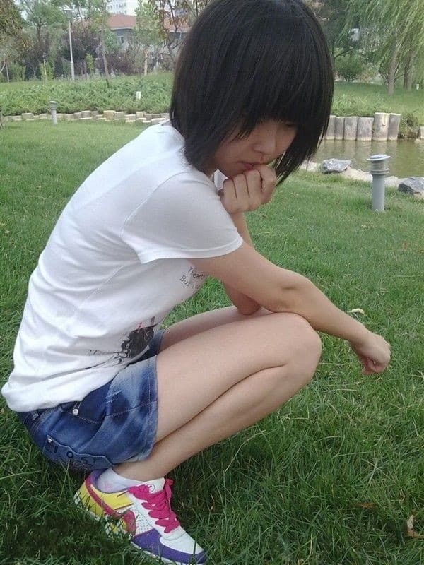 Pair of slightly worn cotton socks gently wrapped around a foot, fabric texture and toe outline visible.