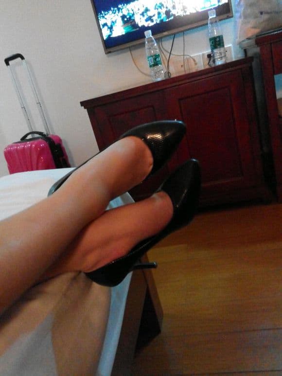 Delicate toes in sheer hosiery with soft light accentuating the arch