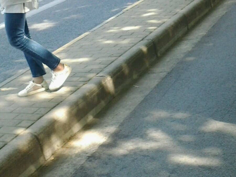 Studio scene of feet developing through layers of stocking and lace, soft lighting highlighting nylon texture and shape.