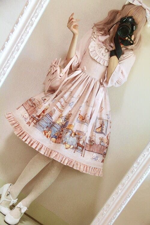 Adorned feet in frilly socks and lace-trimmed shoes, posed on soft carpet with pastel Lolita-inspired outfit partially visible