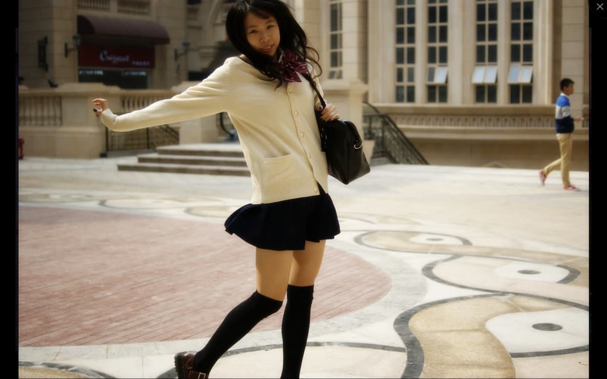 Candid close-up of bare feet slipped from ankle socks, soft skin, nylon sheen, toes slightly curled on cozy bedspread