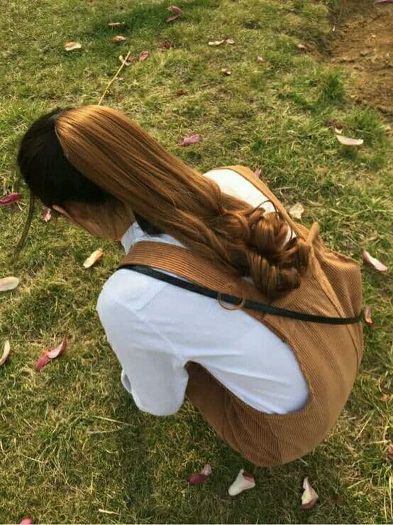 Portrait of long legs in sheer stockings stretched out casually, light accentuating nylon texture and calf curves.