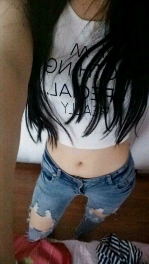 Nighttime close-up of stocking-trimmed ankle, soft shadows and nylon glint creating an intimate mood.