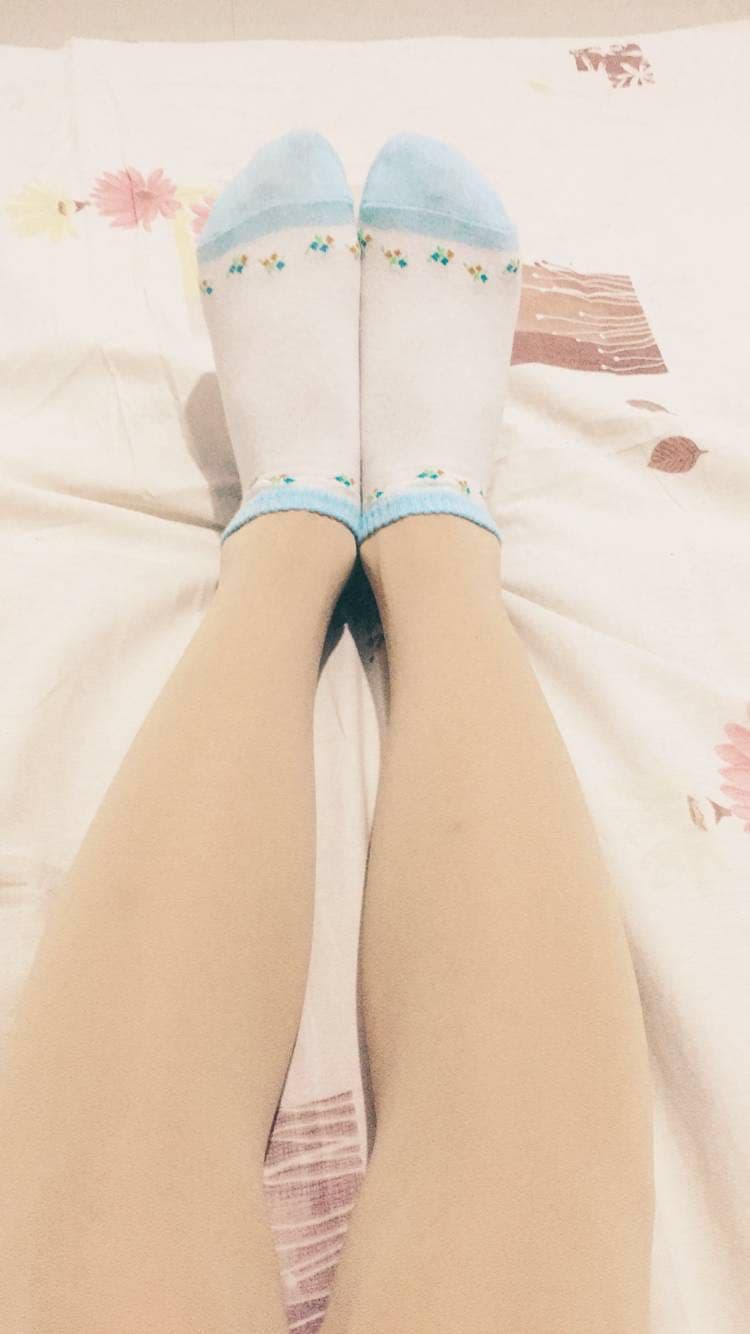 Portrait of alluring feet in sheer stockings, toes elegantly posed inviting a private, intimate glance.