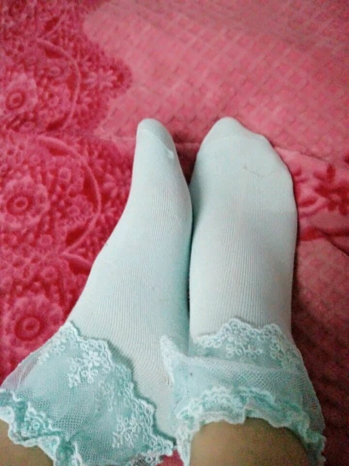 Shy bare feet in cozy socks