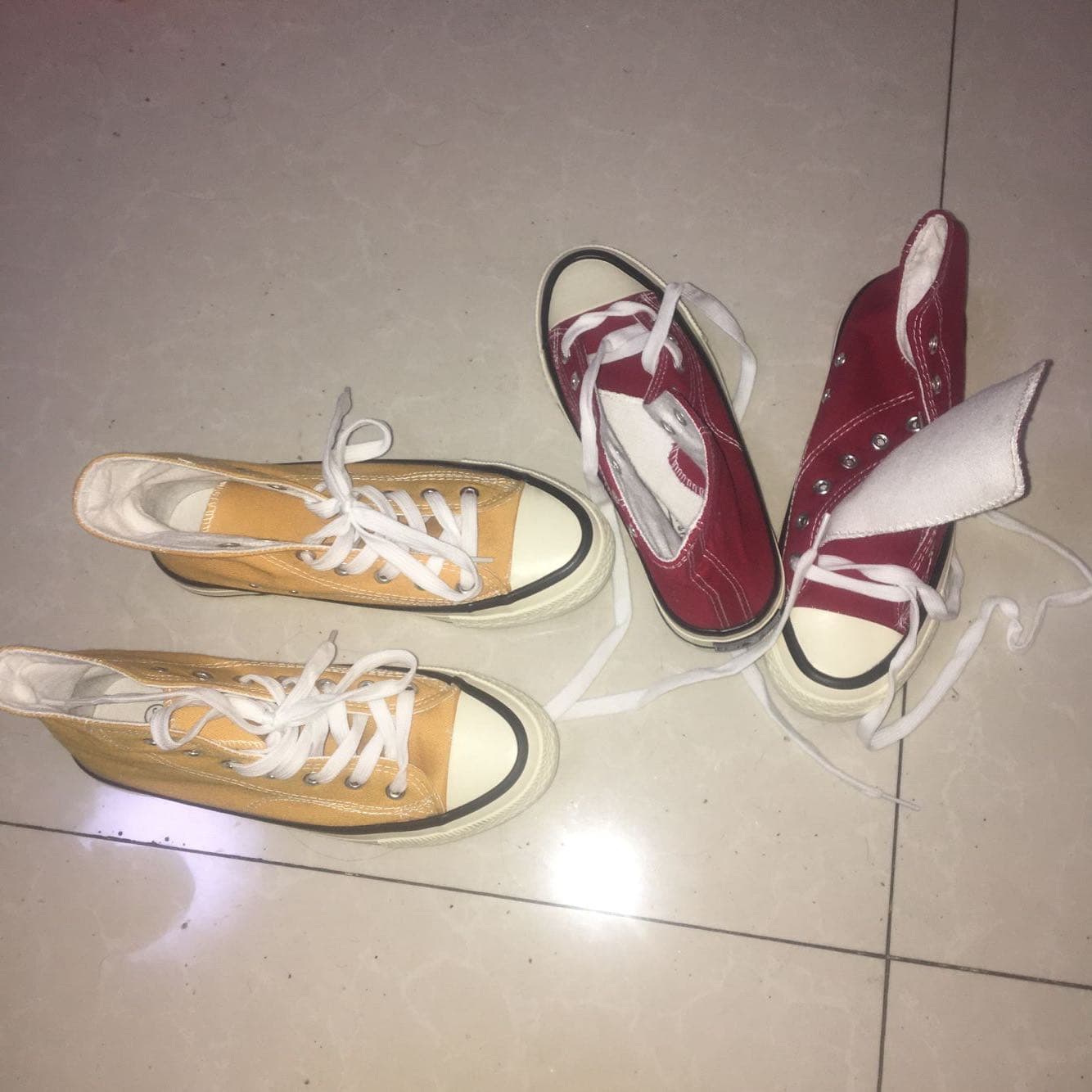 Closeup of damp cotton sock peeled away from a slightly sweaty bare heel