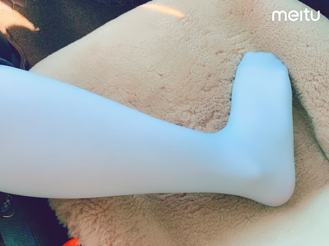 single close-up of stockinged foot