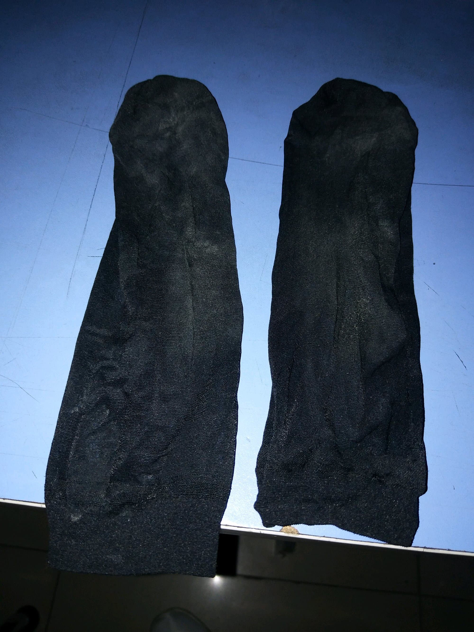 worn black nylons on bare feet