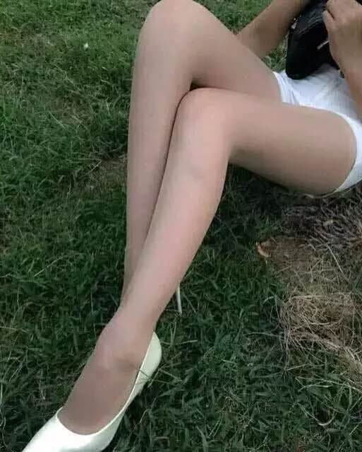 feet dangling by table