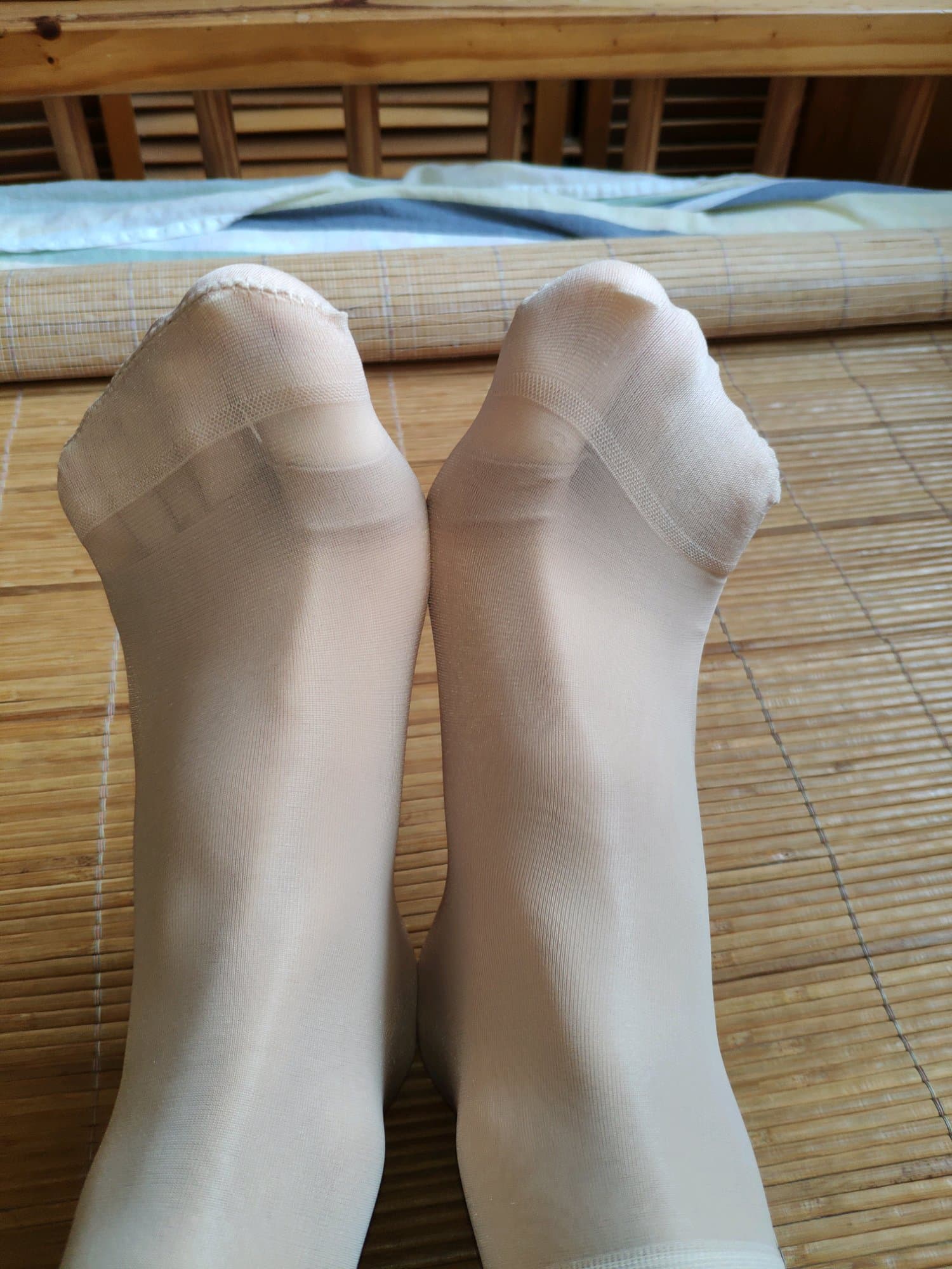 Hand gently cradling a bare sole ready for a scratch