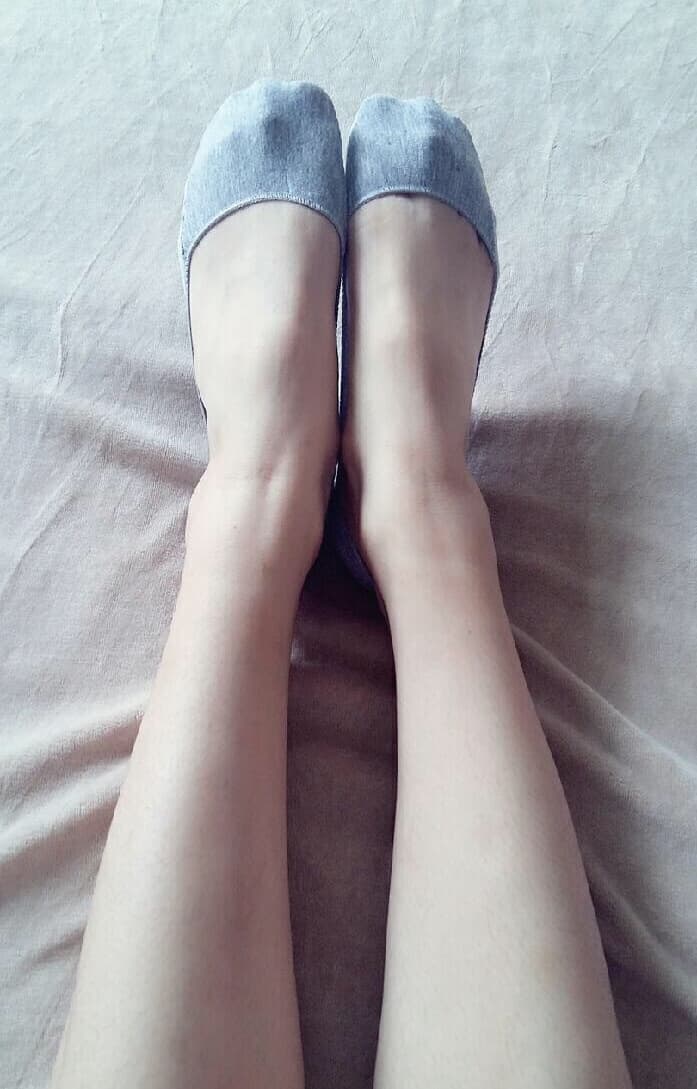 Long legs sheathed in glossy stockings