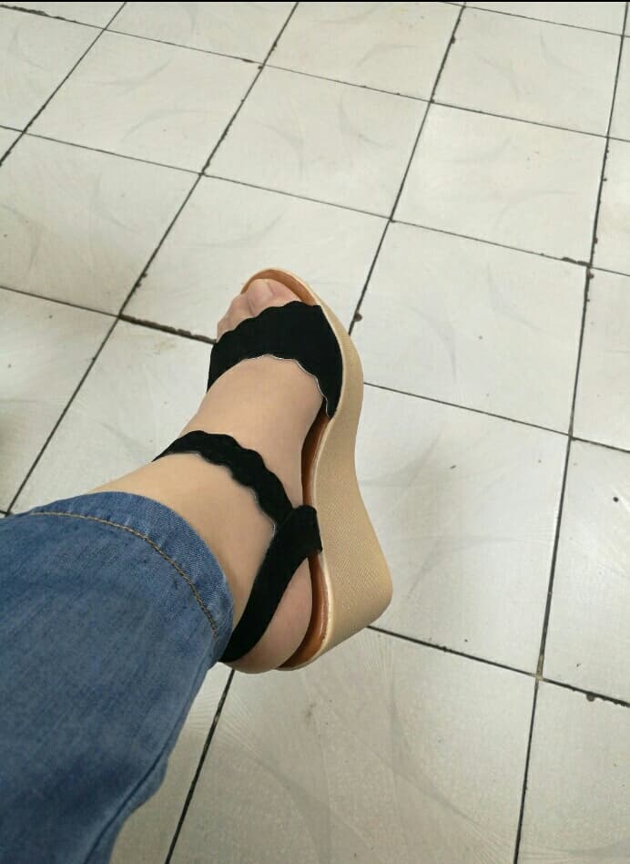 Bare strappy sandal feet
