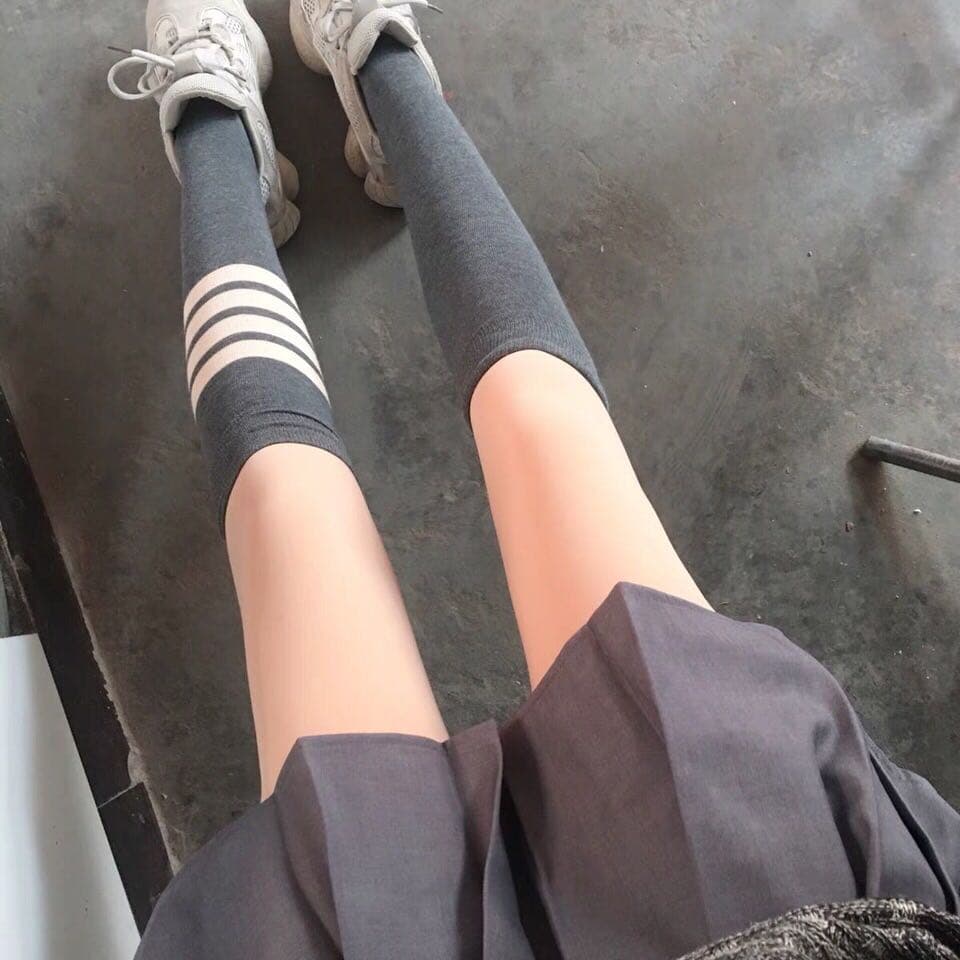 Stockings rolled down to bare soles