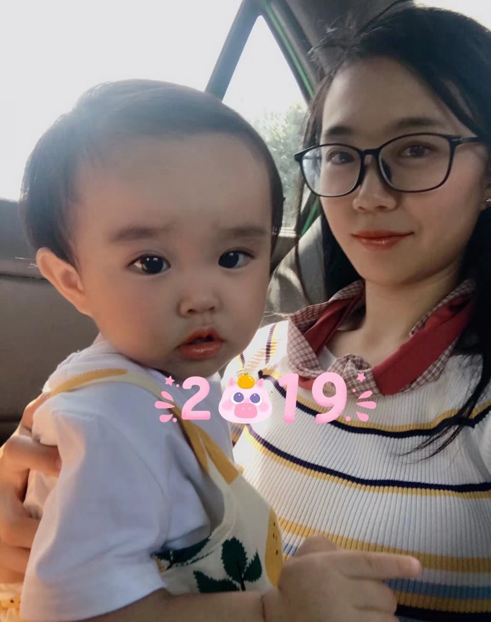 Soft portrait of a woman adjusting sheer stockings with a focus on seam detail and silky texture