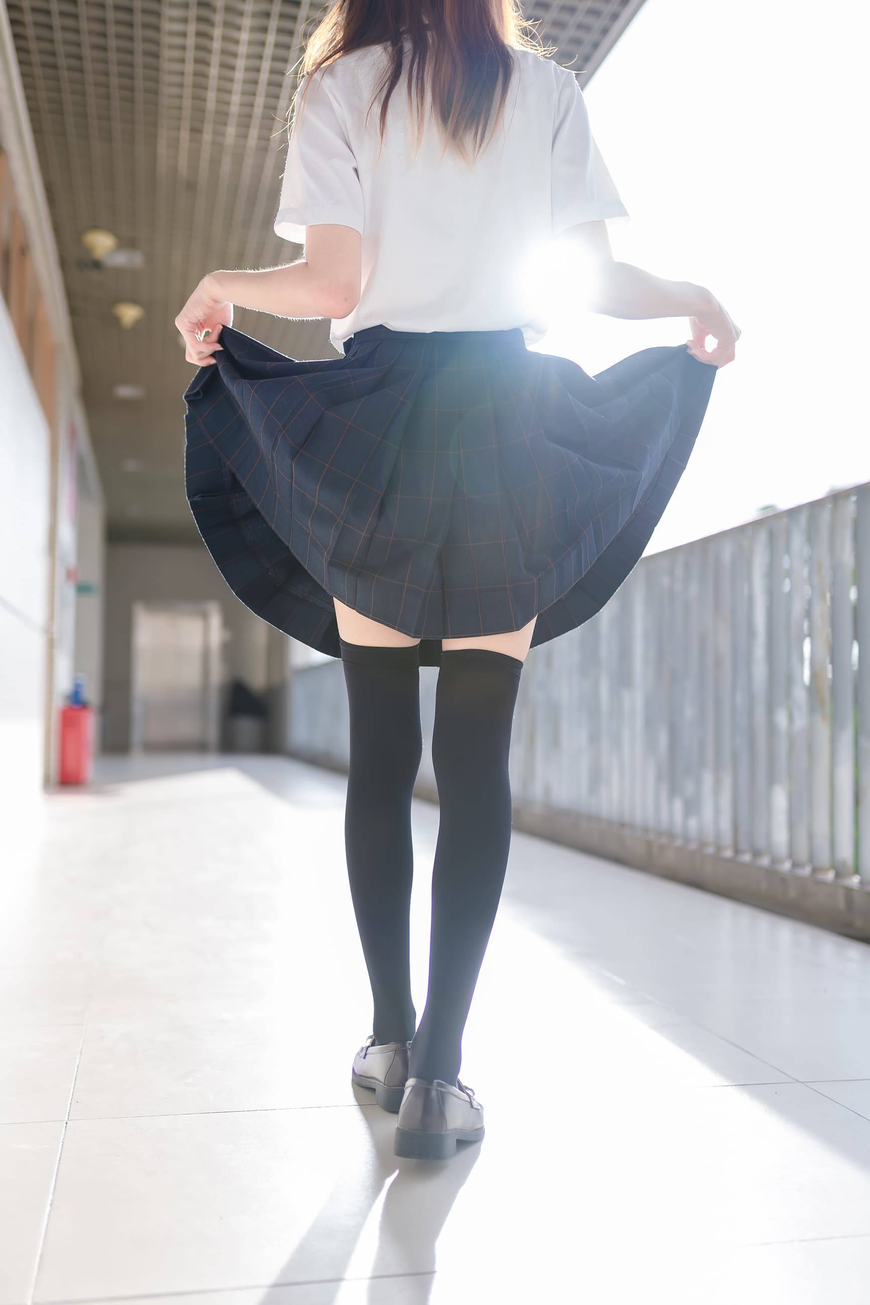 Sunlight on a stockinged leg and toe