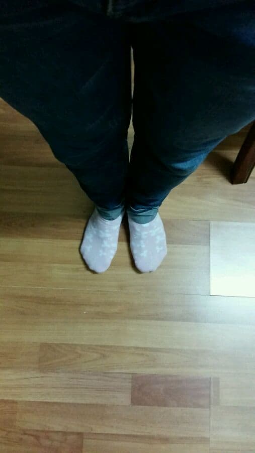 Close-up of bare arches and nylons