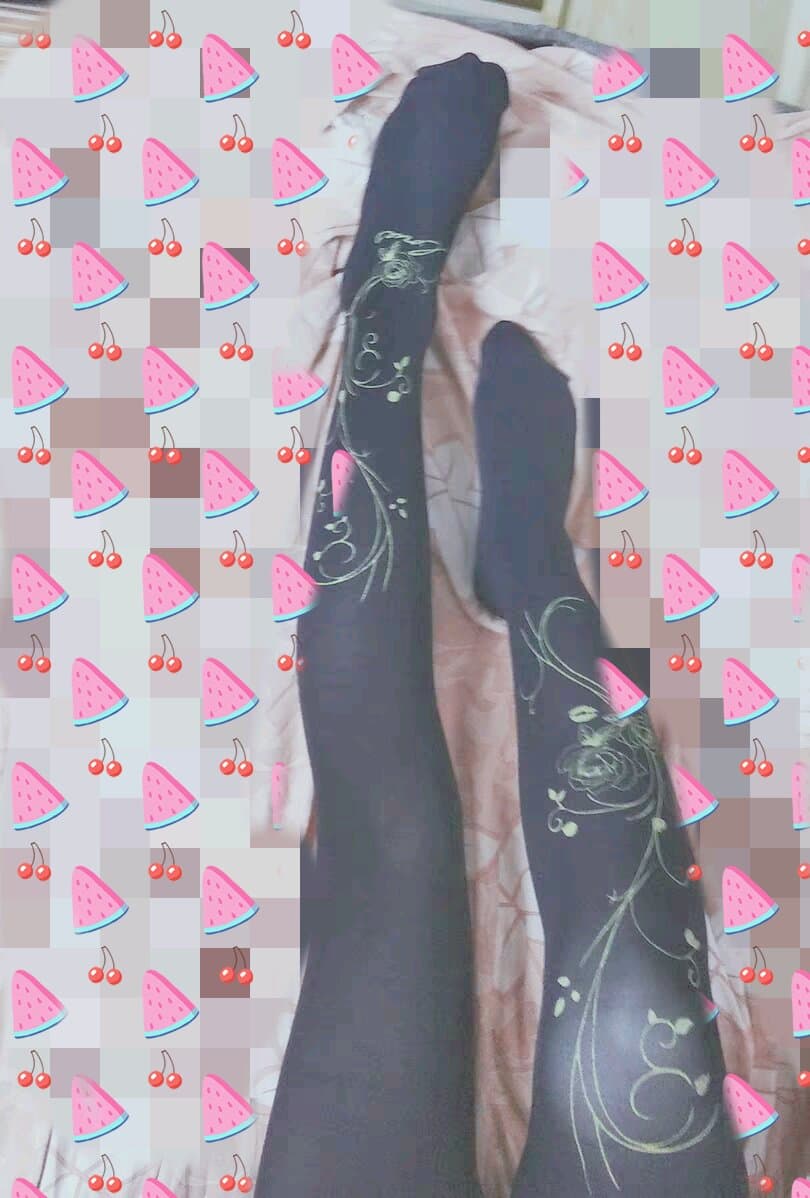 Bare feet curled on a soft sheet