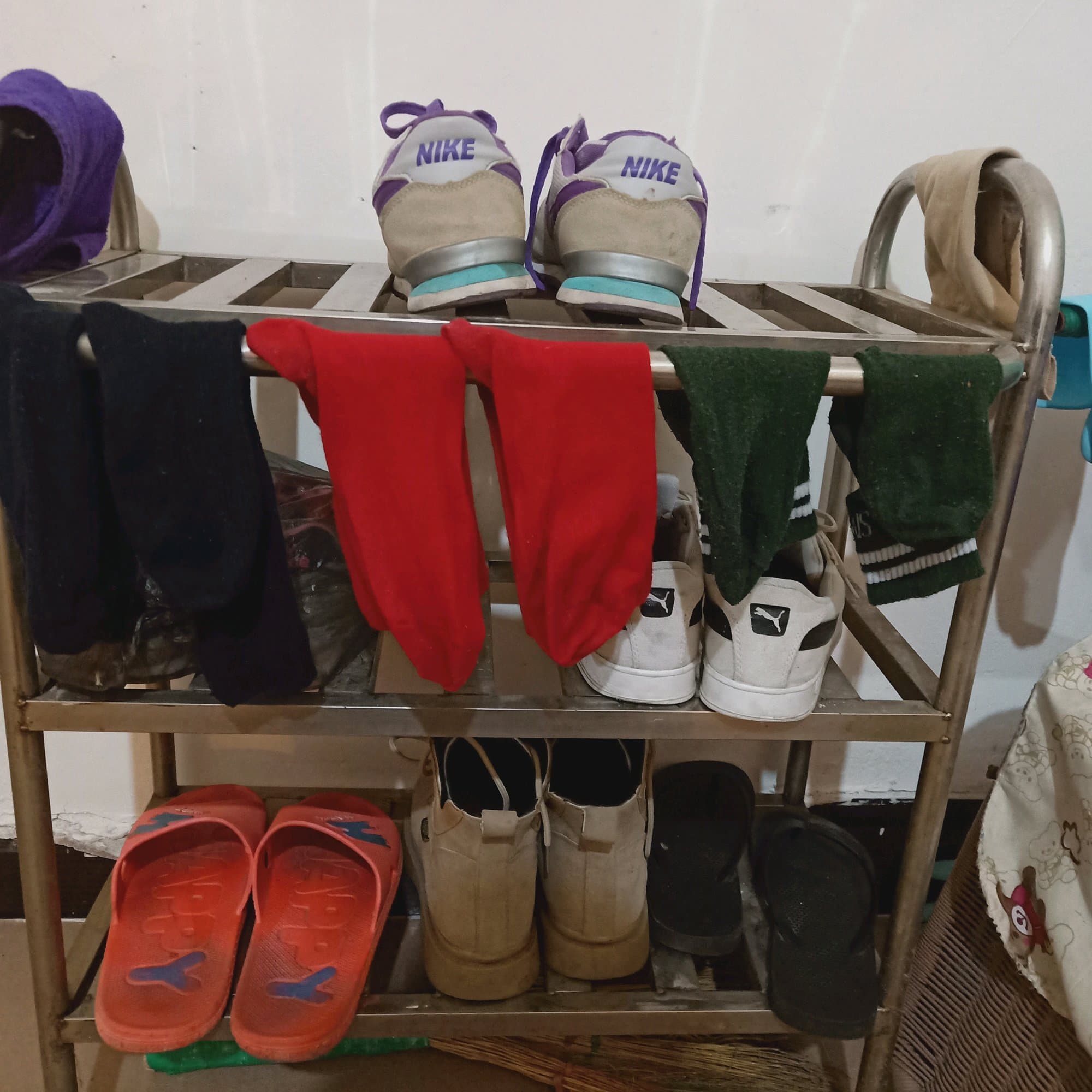 Petite girlfriend’s feet in sheer stockings, toes peeking and ankle softly bent in a shy pose