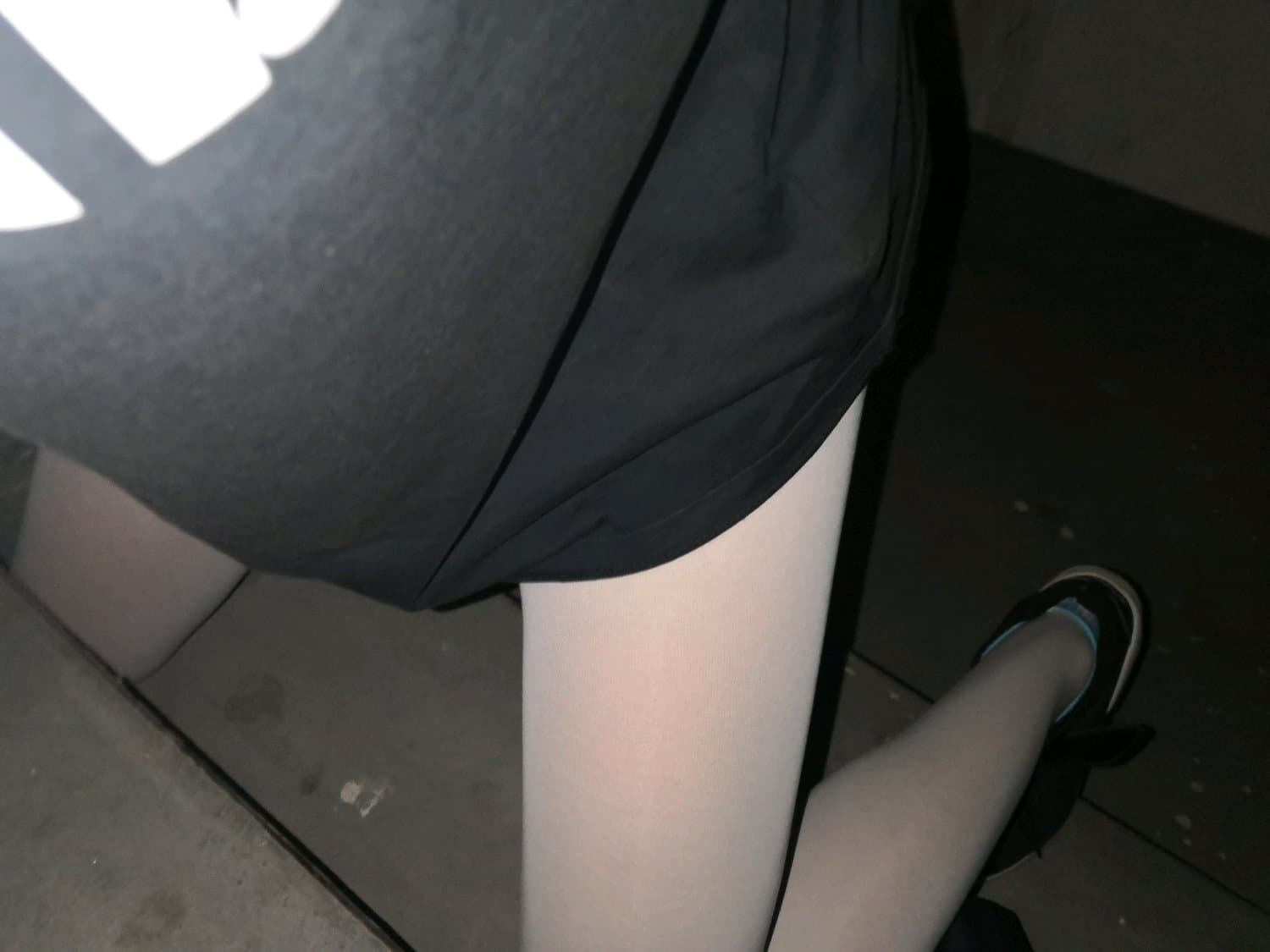 Adult couple exchanging soft socks and a small sweet, bare ankles and playful hands visible