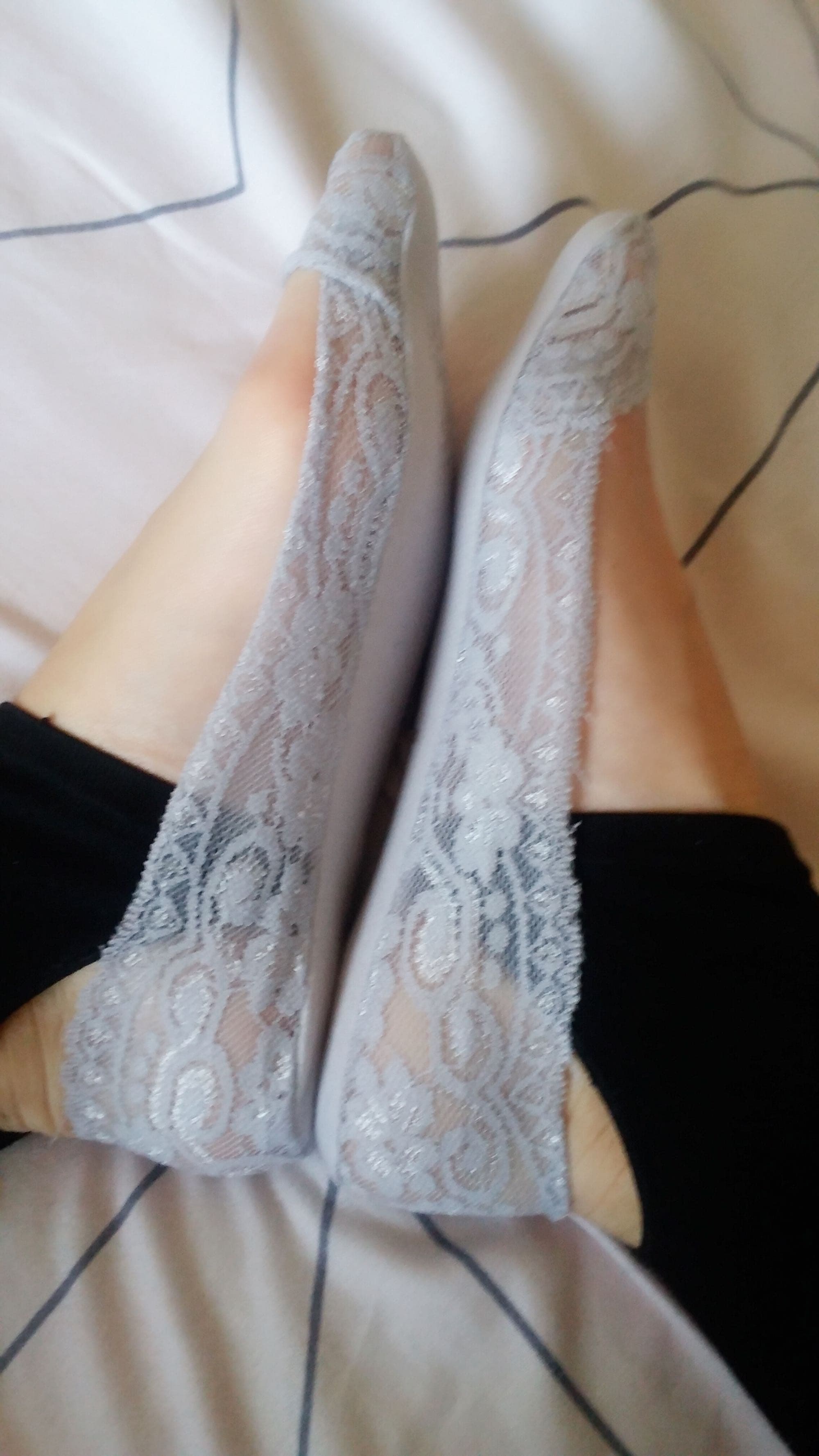 grey socks and bare feet