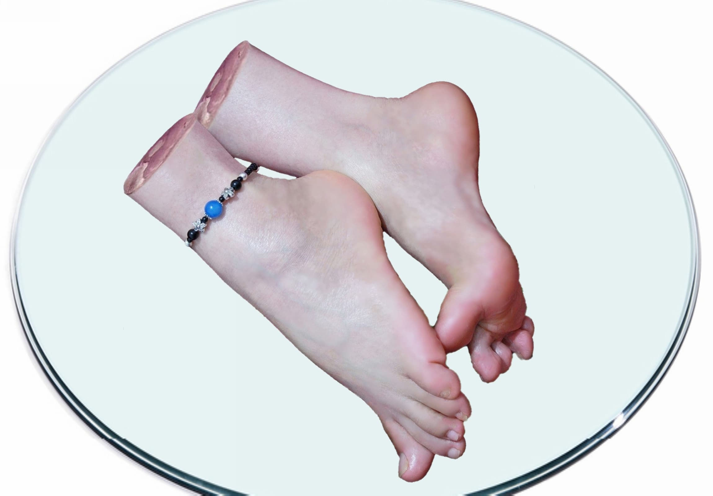 Healed foot with faint scar lines and a bandage at the arch, toes relaxed and highlighted by gentle, warm studio lighting for emotional effect