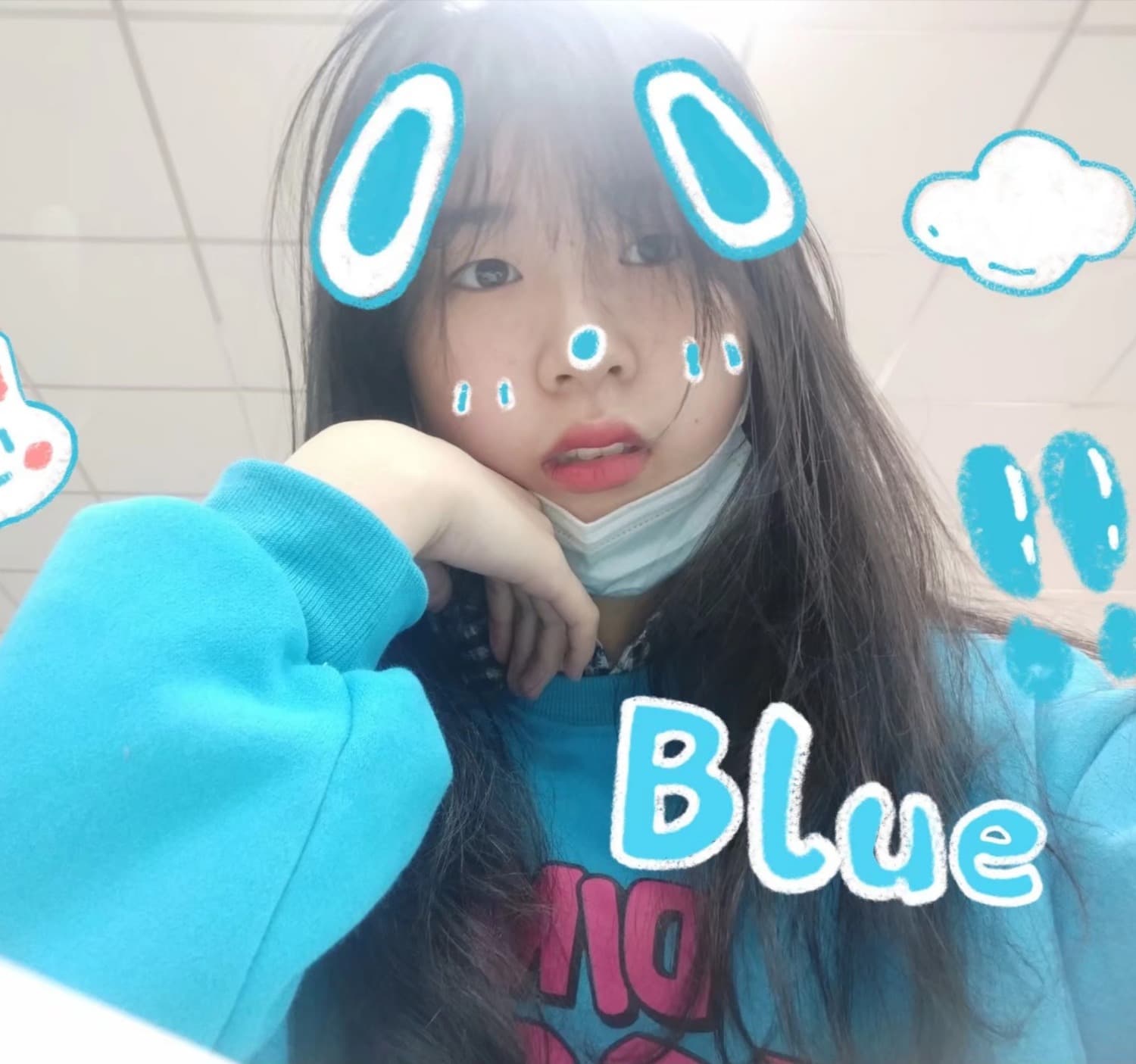 Foot in cotton sock partially rolled down, toes just peeking out against a muted background