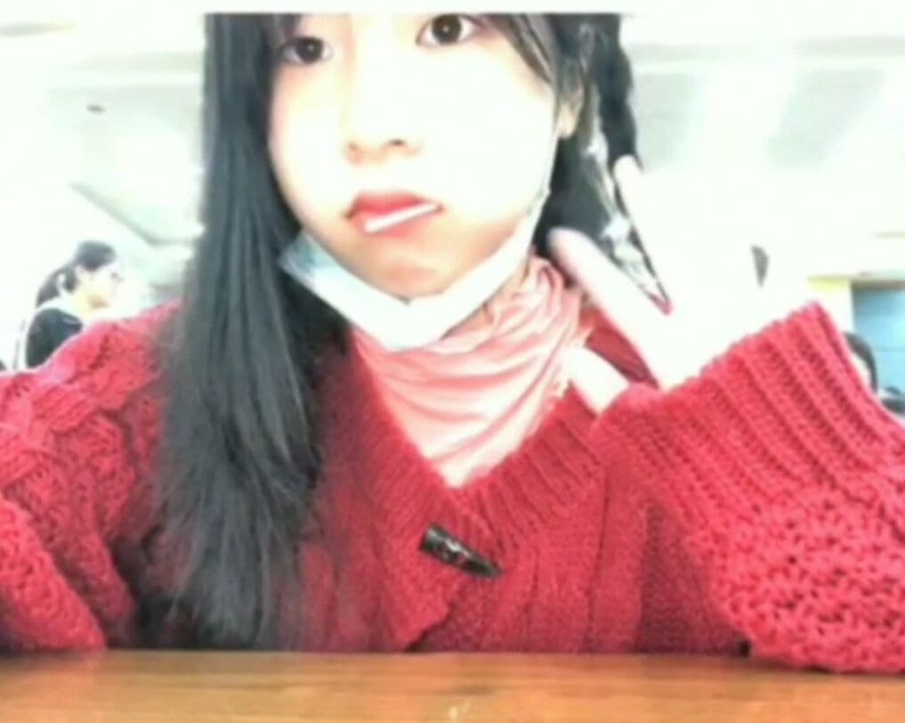 Soft-lit image of bare soles parted on a plush surface, toes flexed and nails painted, inviting a private, tactile gaze.