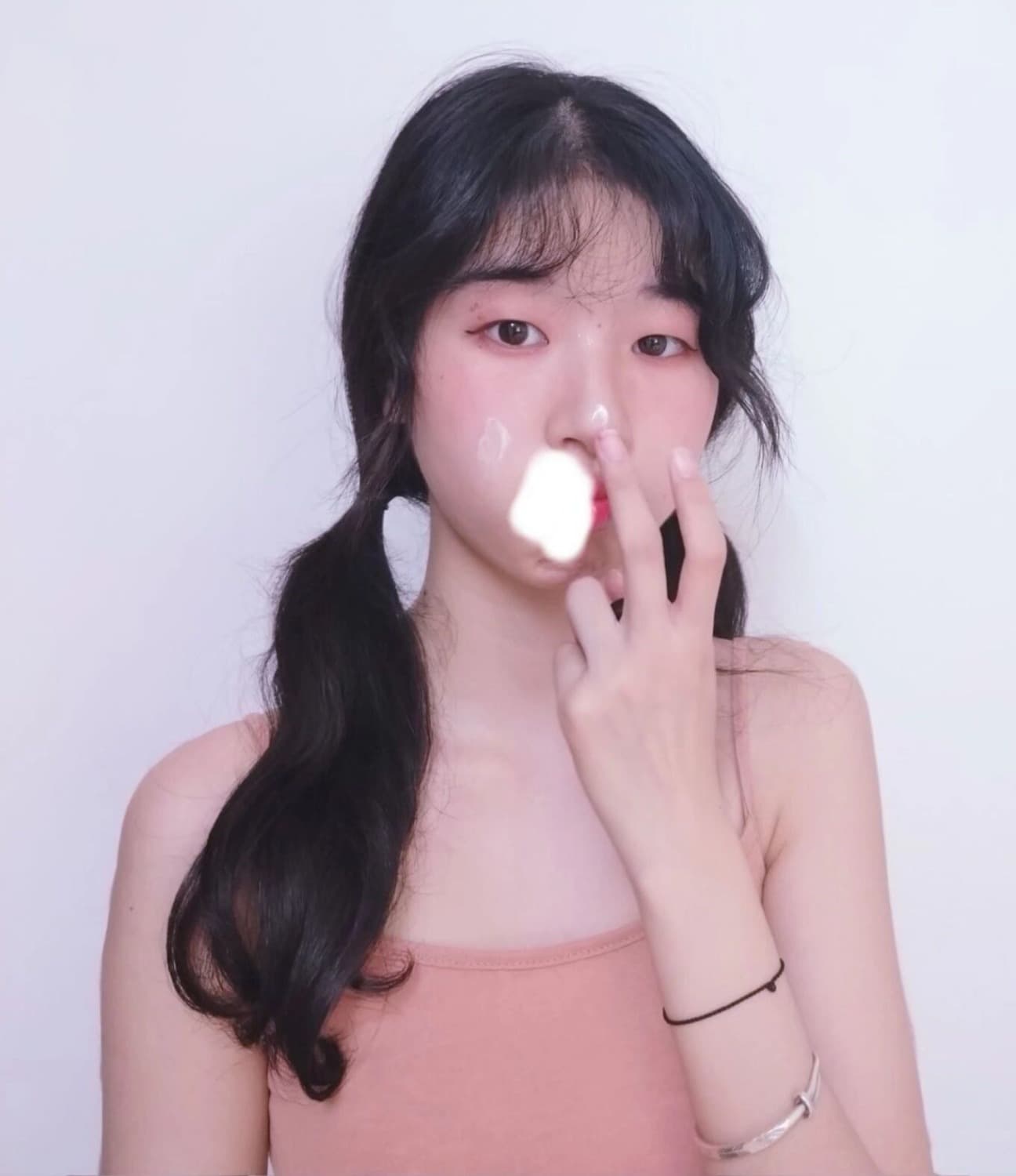 Intimate still of toes peeking from rolled socks beside a neatly folded pair of sheer stockings