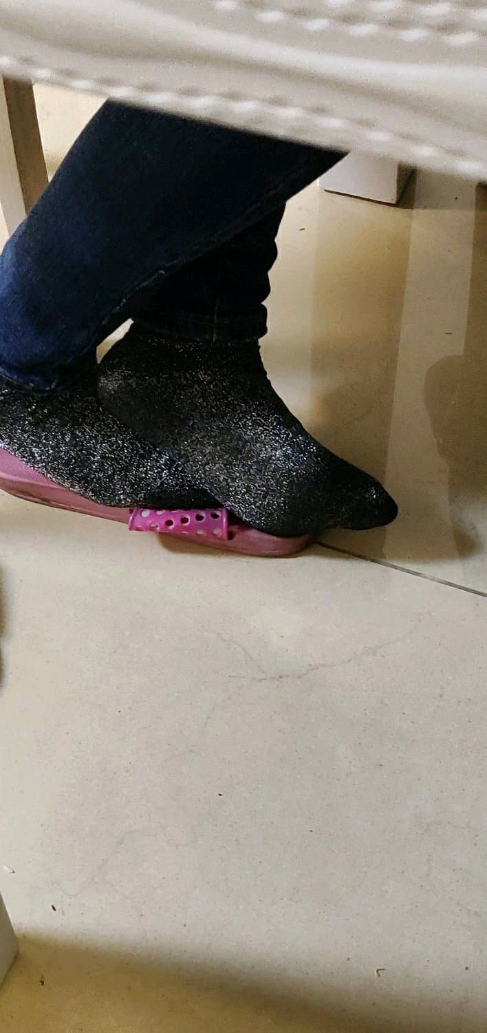 Thick cotton socks pulled up to mid-calf, feet nestled together, fabric texture prominent and cozy.