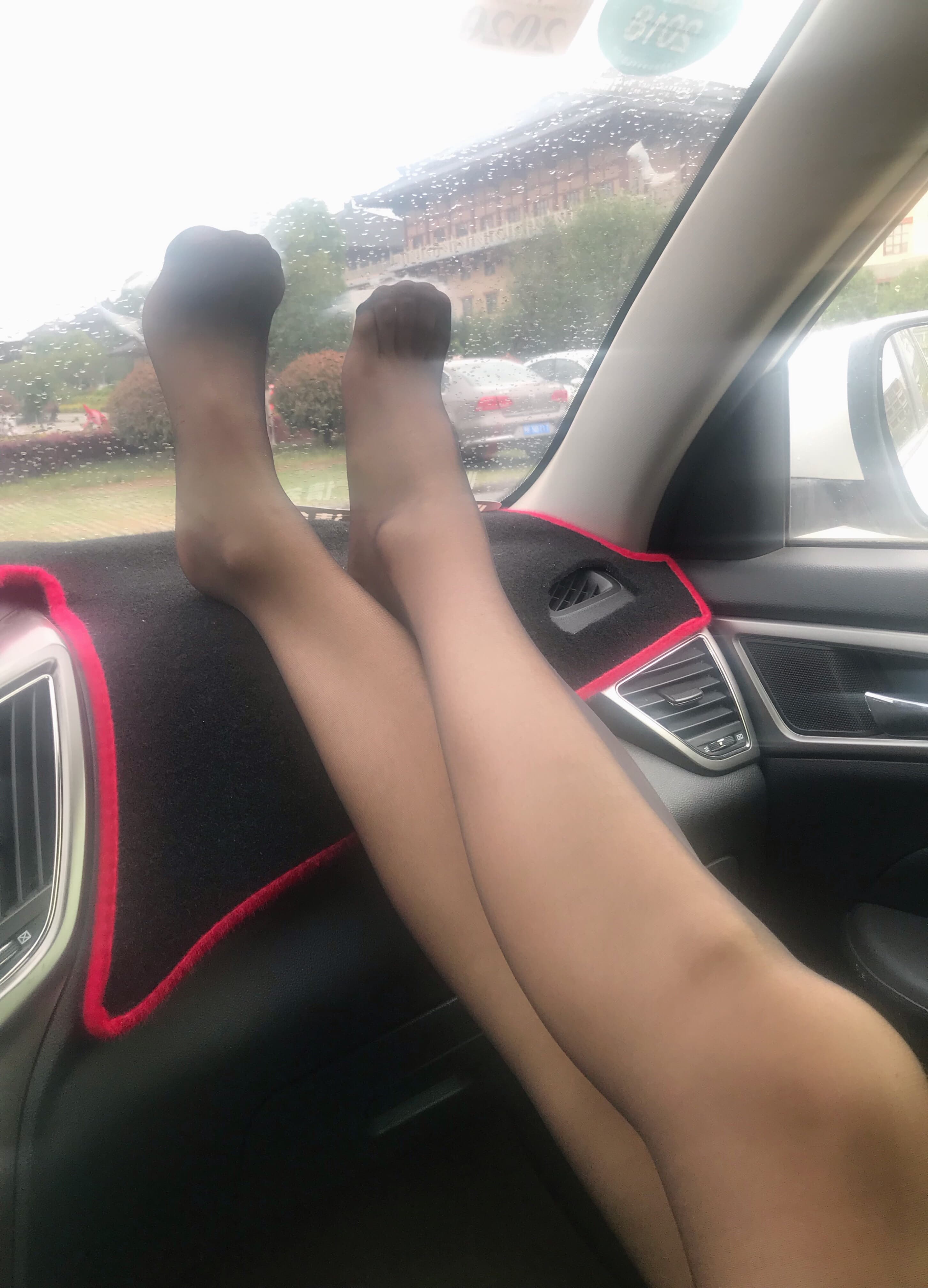 Wind-tossed skirt revealing stocking-clad ankles, nylon shimmering as breeze grazes exposed heel and toes lightly