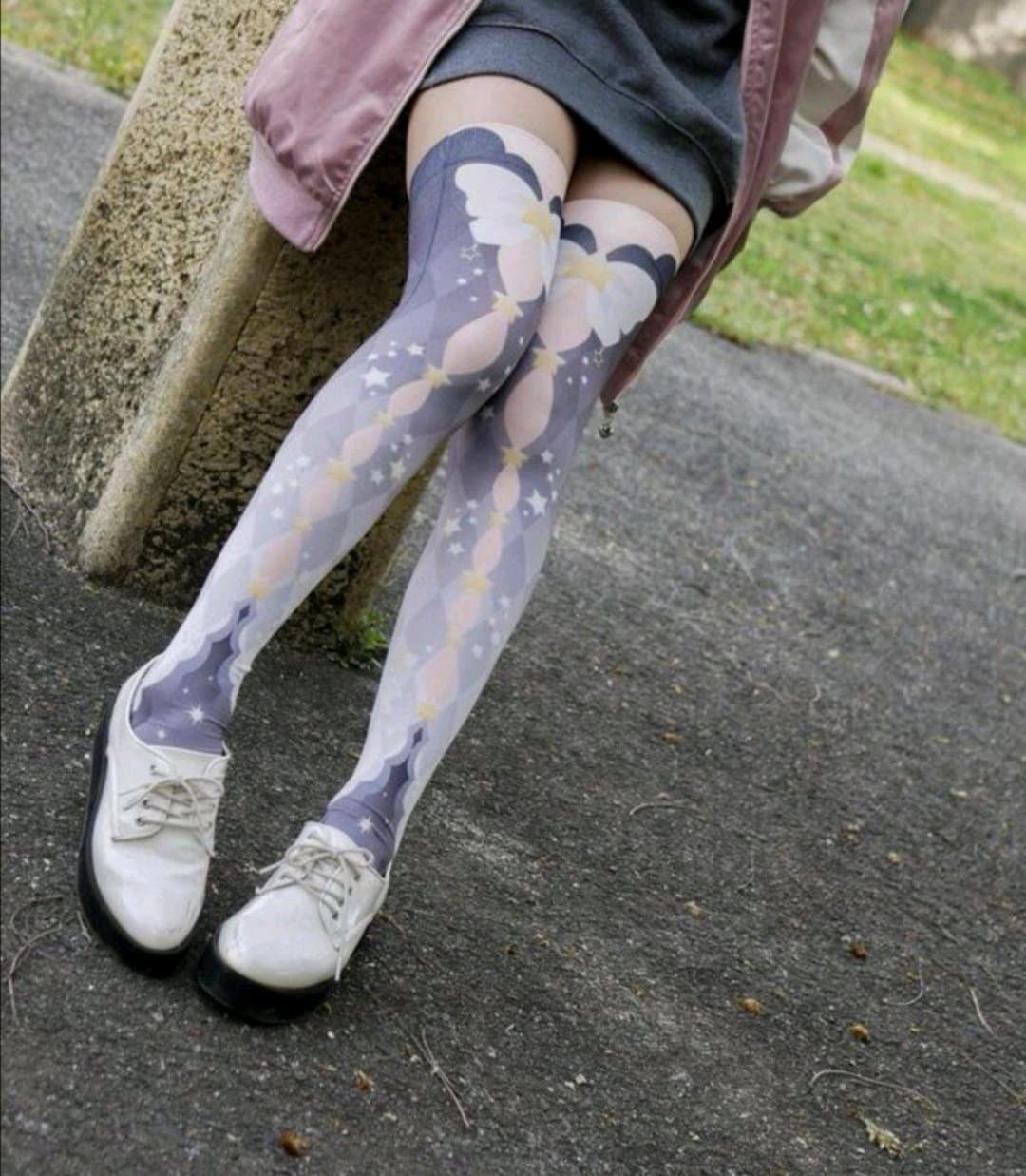 Intimate portrait of an adult girlfriend’s feet in semi-sheer stockings, crossed ankles, polished nails, and soft ambient light.