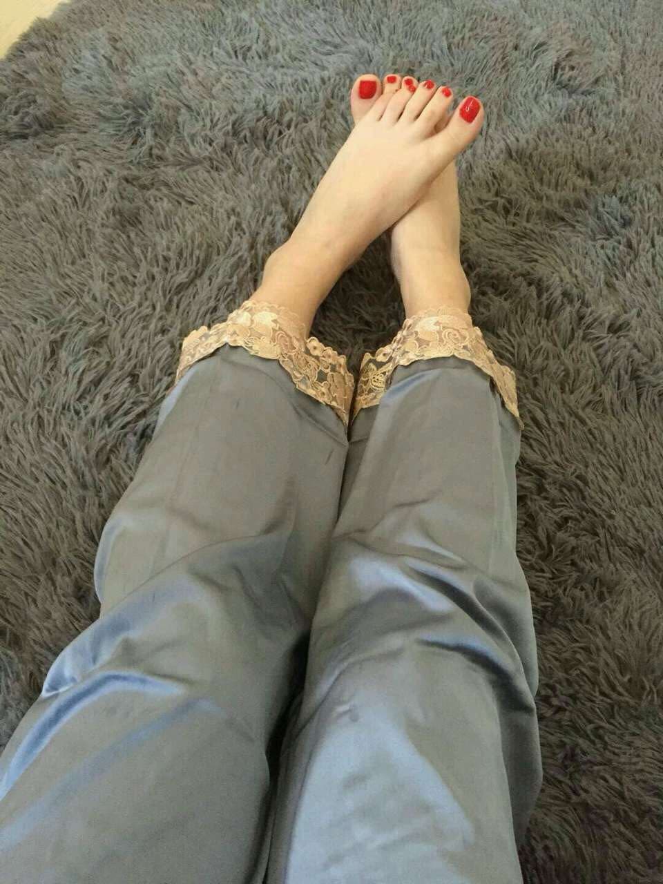 Sunlit feet in cotton socks