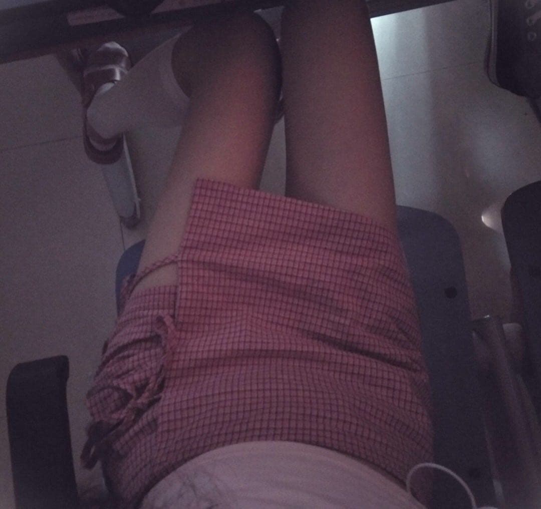 Profile of knee-high socks hugging the calf, with a sliver of bare skin above the cuff and graceful ankle curve